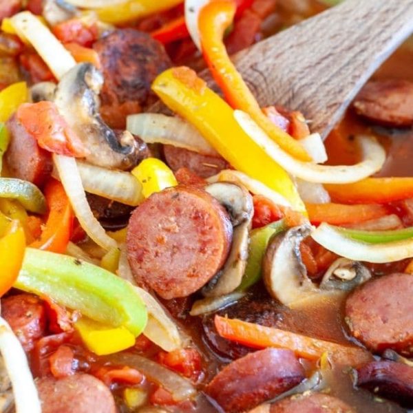Cooked sausage with peppers and onions.