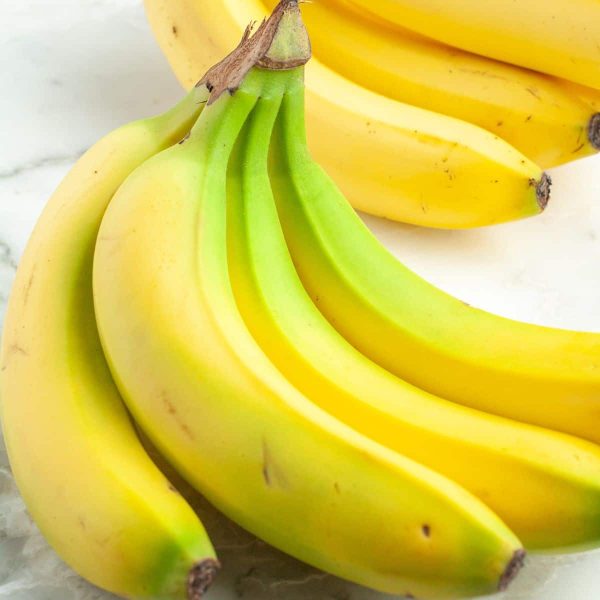 A bunch of bananas on a table.