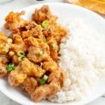 Bowl of fried chicken and rice.