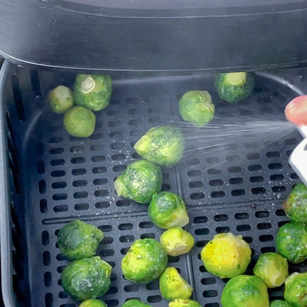 Oil misting on brussel sprouts.