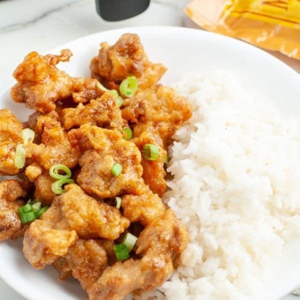 Bowl of orange chicken and rice.