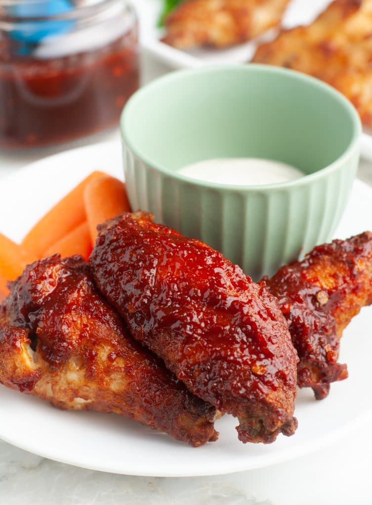 Plate of chicken wings with a bowl of ranch. 
