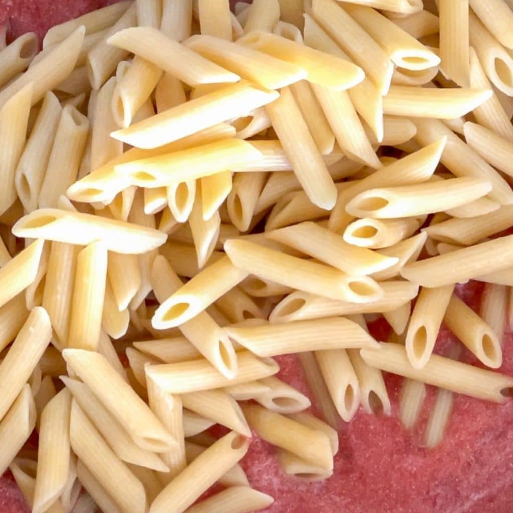 Penne pasta in sauce.