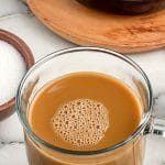 Clear coffee mug filled with coffee.