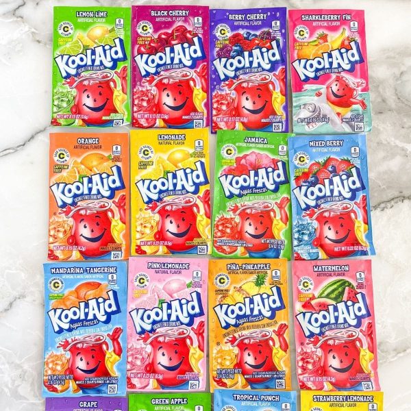 Different packets of Kool-Aid flavors on a counter.