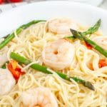 Bowl of pasta, shrimp, and asparagus.