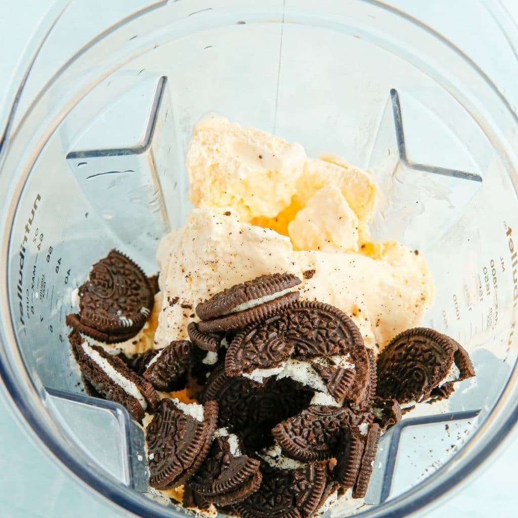 Blender with Oreo cookies and vanilla ice cream.