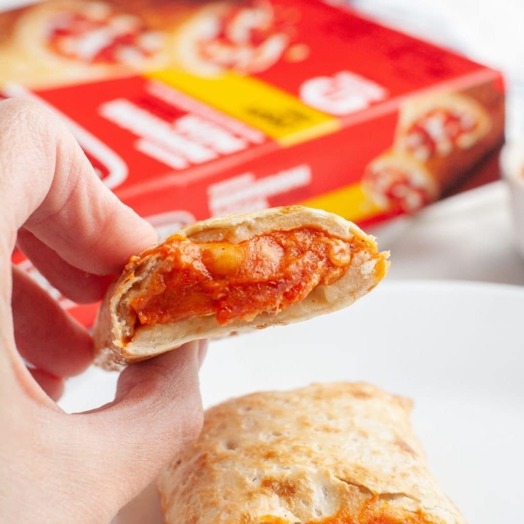 Hand holding a Hot Pocket.