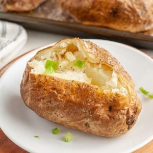 Baked potato on a plate.