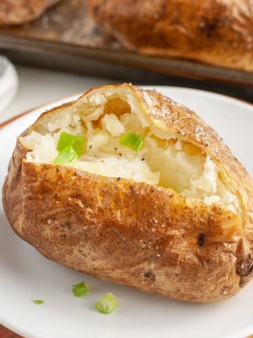 Baked potato on a plate.