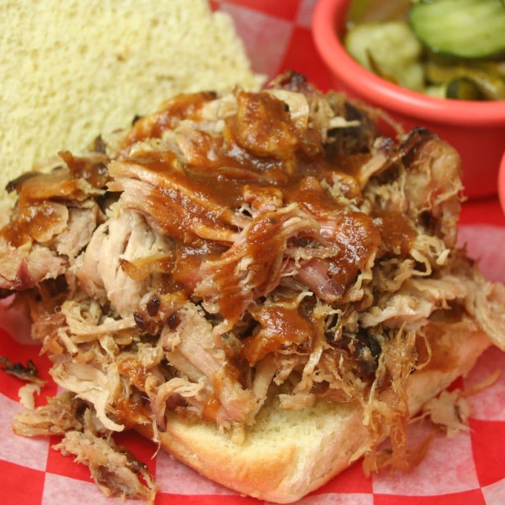 Pulled pork sandwich with sauce.