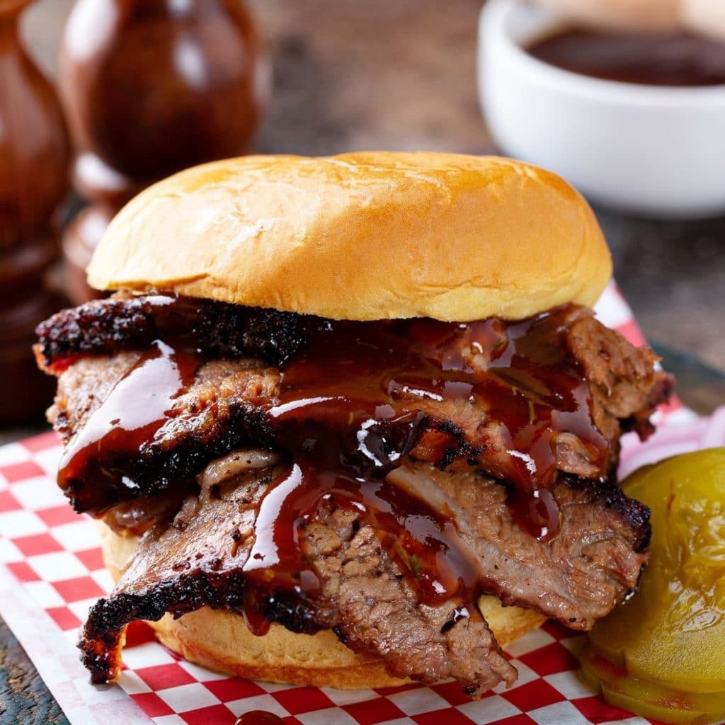 Brisket sandwich and pickles. 