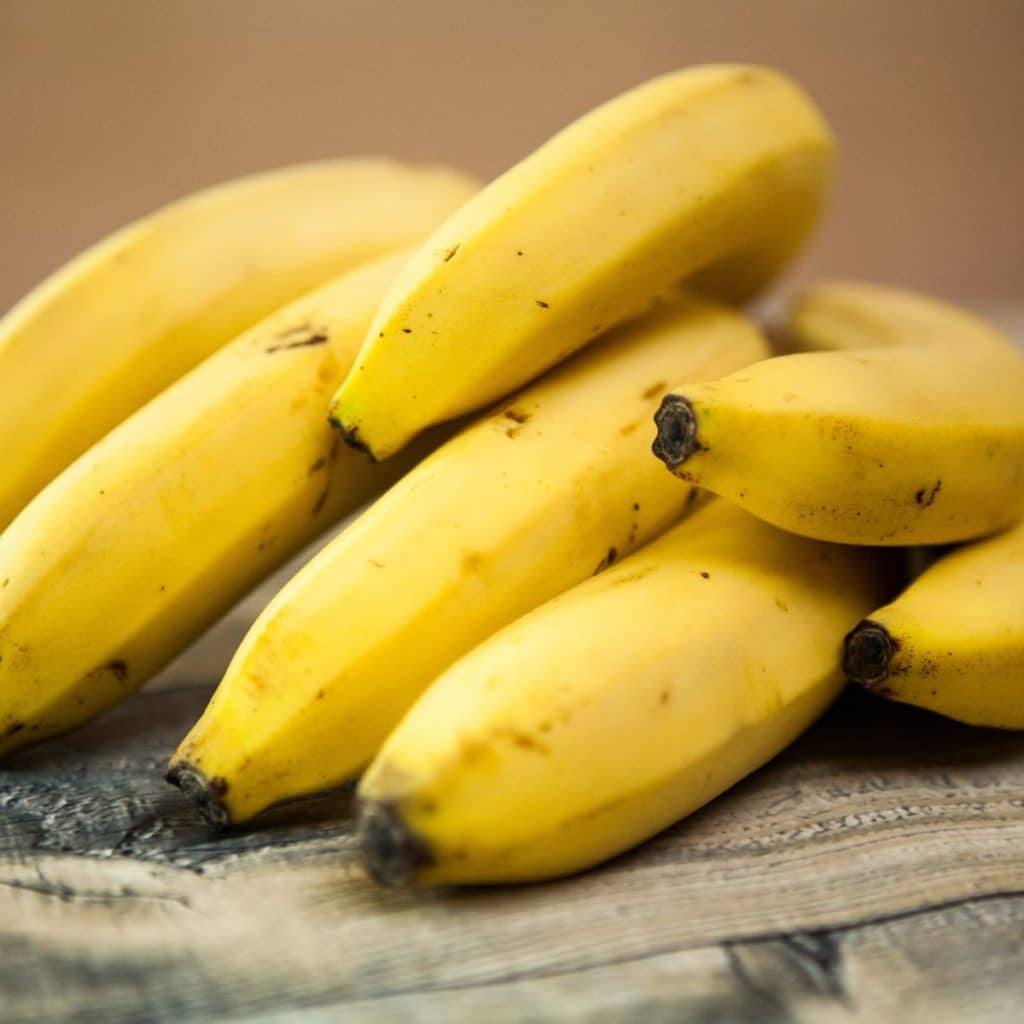 Bunch of bananas on a table. 