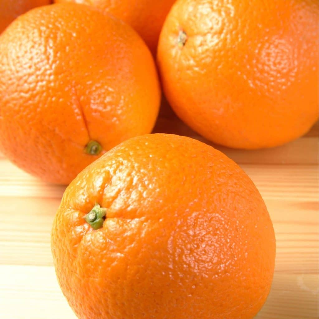 Oranges on a table.