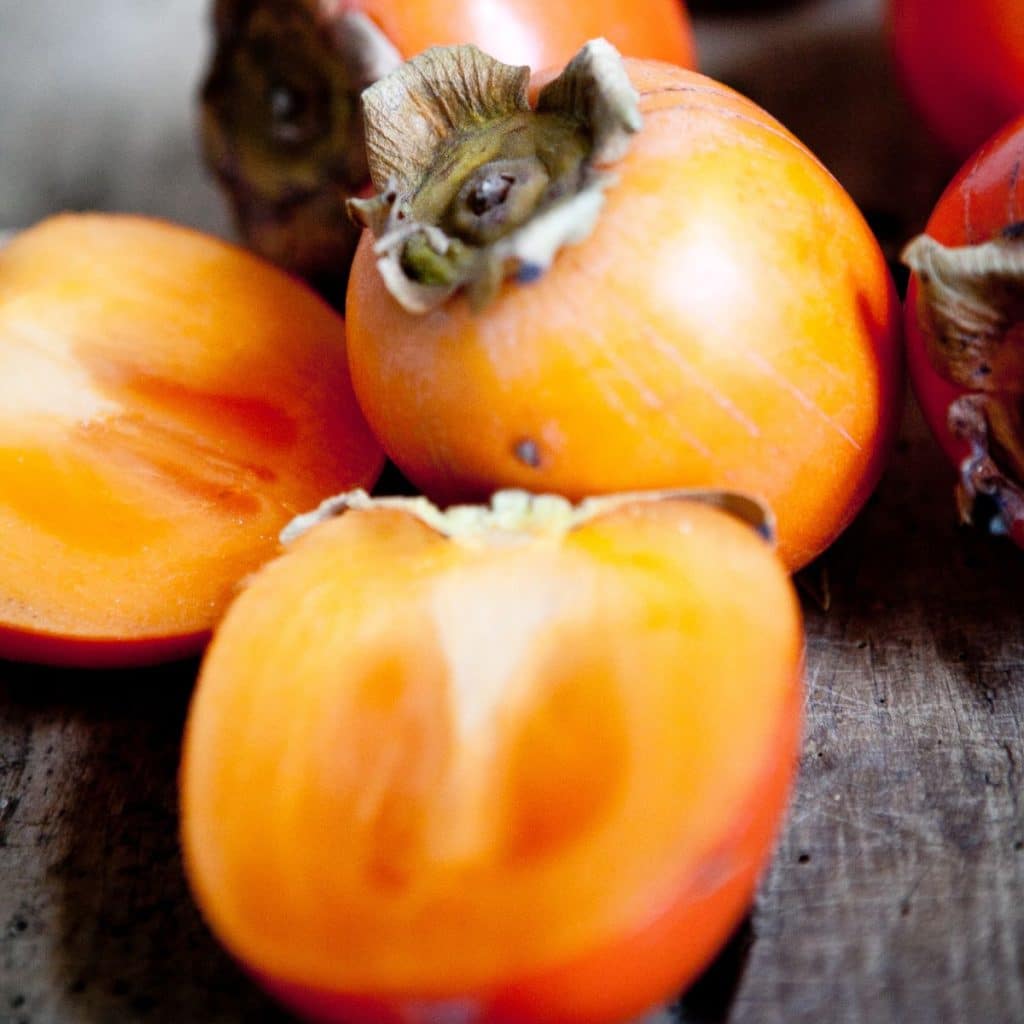 Sharon fruit cut in half. 