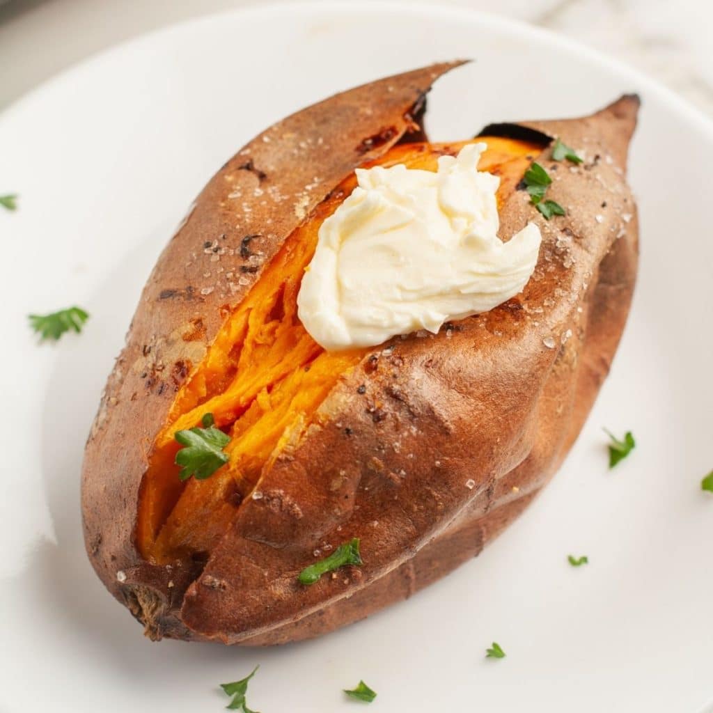 Baked sweet potato on a plate.