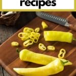 Banana peppers on a cutting board.