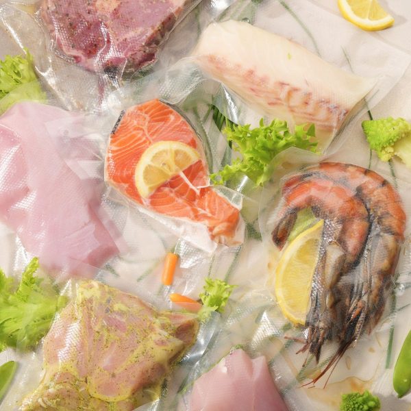 Salmon, chicken, and steak in sous vide bags.