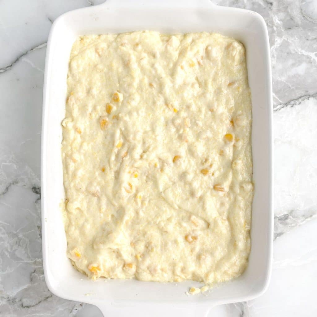 Baking dish filled with corn pudding. 