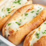 Meatball sandwiches in casserole dish.