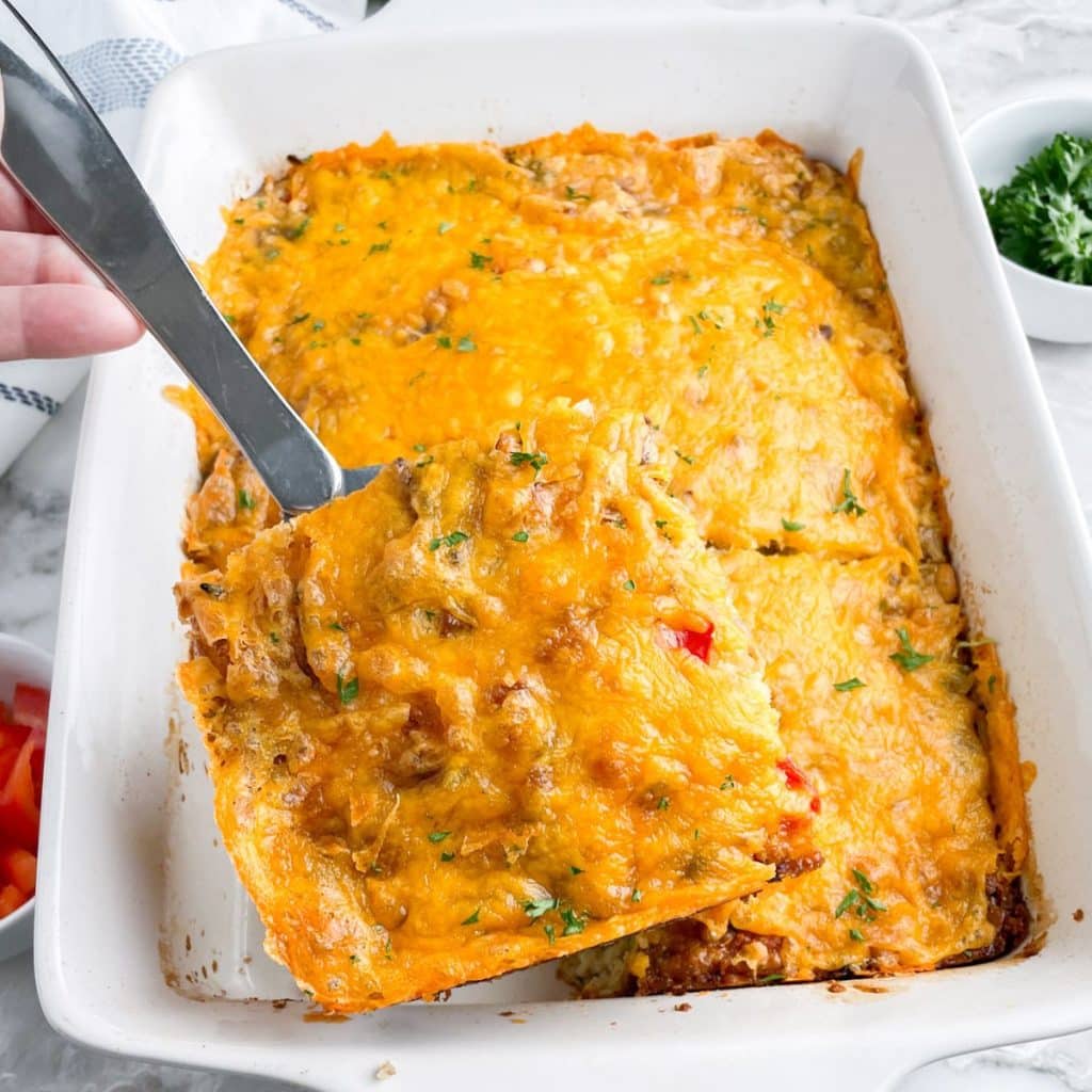 Slice of breakfast casserole on a serving spoon. 