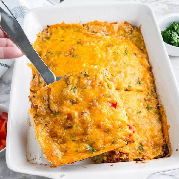 Slice of breakfast casserole on a serving spoon.