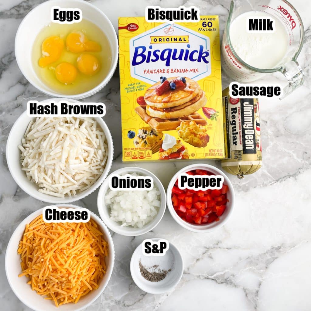 Bowl of eggs, cheese, hash browns, peppers, sausage, and box of Bisquick. 