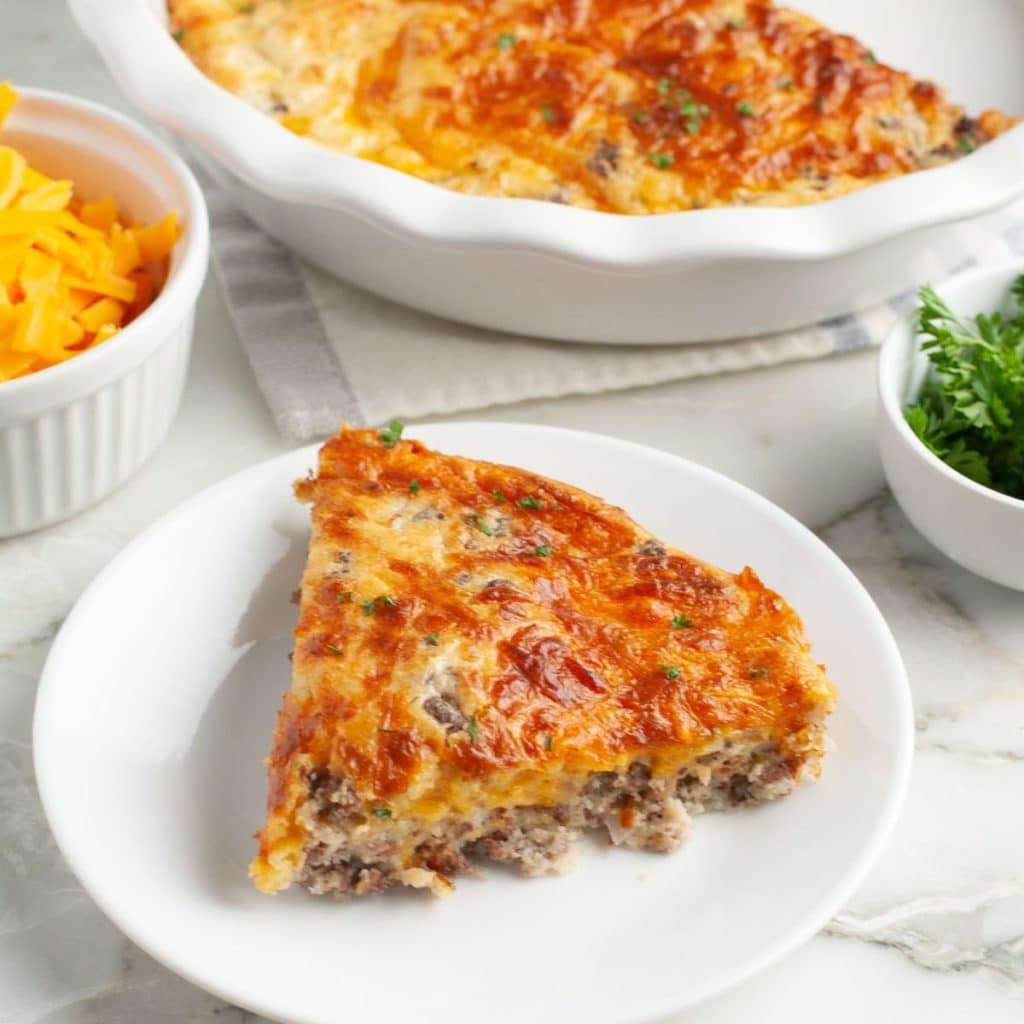 Slice of hamburger pie on a plate. 