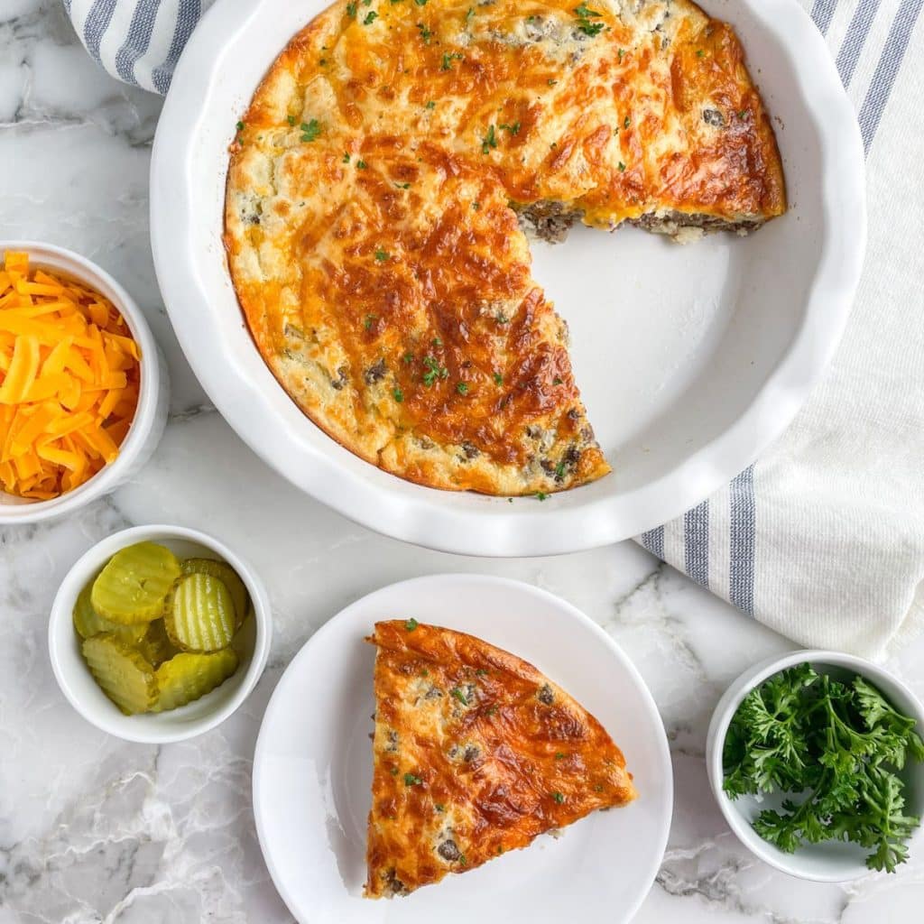 Egg quiche in a pie plate and on a small plate. 