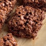 Piece of square shaped chocolate rice krispie treat.