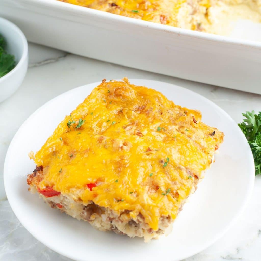 Piece of breakfast casserole on a plate. 