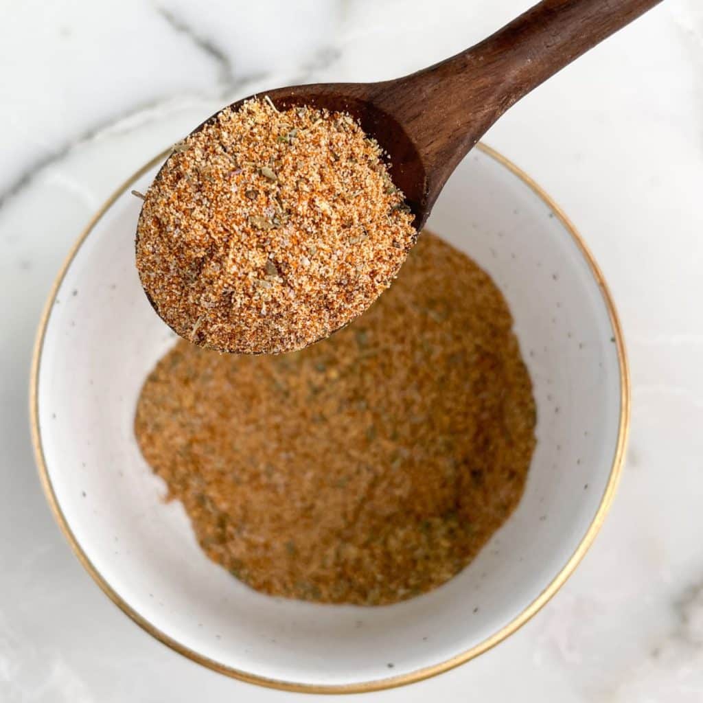 Bowl and spoon with seasonings.