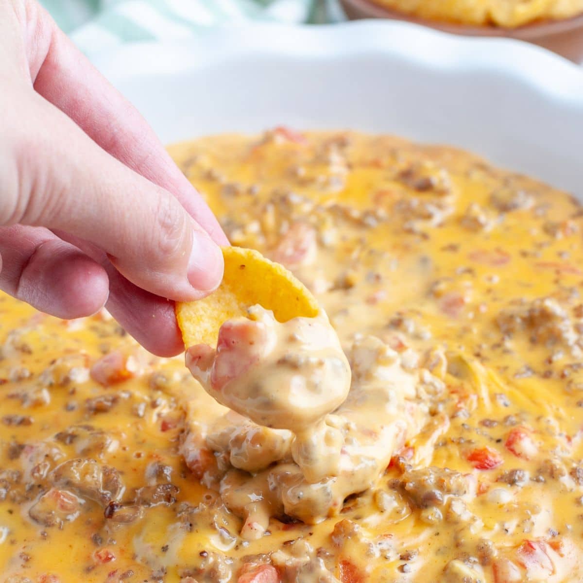 https://www.foodlovinfamily.com/wp-content/uploads/2022/10/velveeta-sausage-dip.jpg