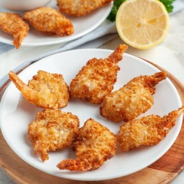 Cooked coconut shrimp on a plate.
