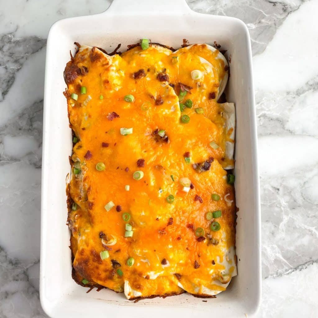 Casserole dish with cheesy pierogi casserole.