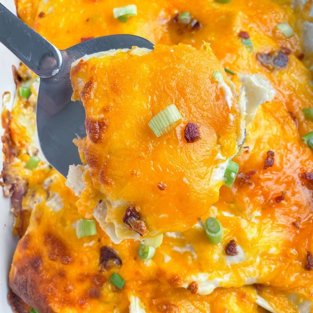 Spatula with cheesy casserole. 