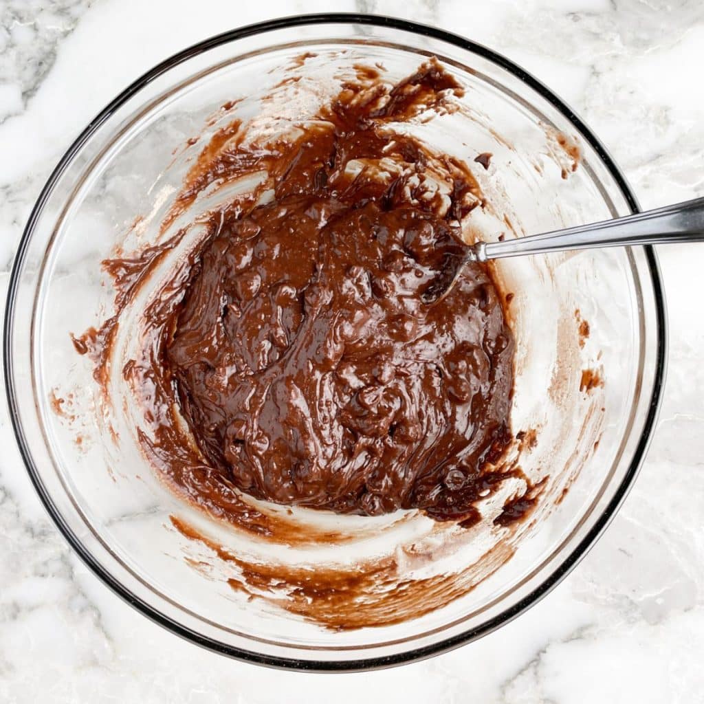 Bowl of brownie batter and a spoon. 