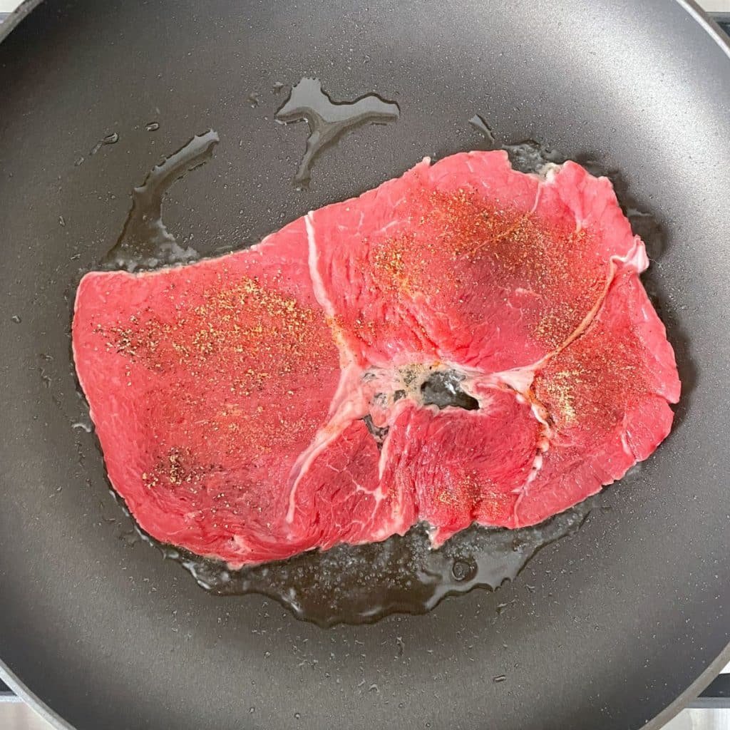 Skillet with steak. 