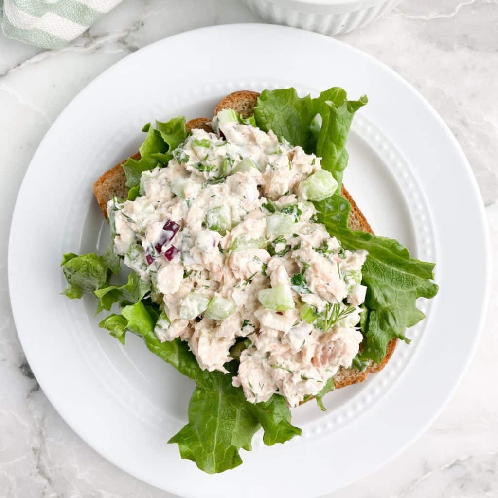 Salmon salad on lettuce and bread. 