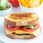 Meatloaf sandwich and bowl of chips.