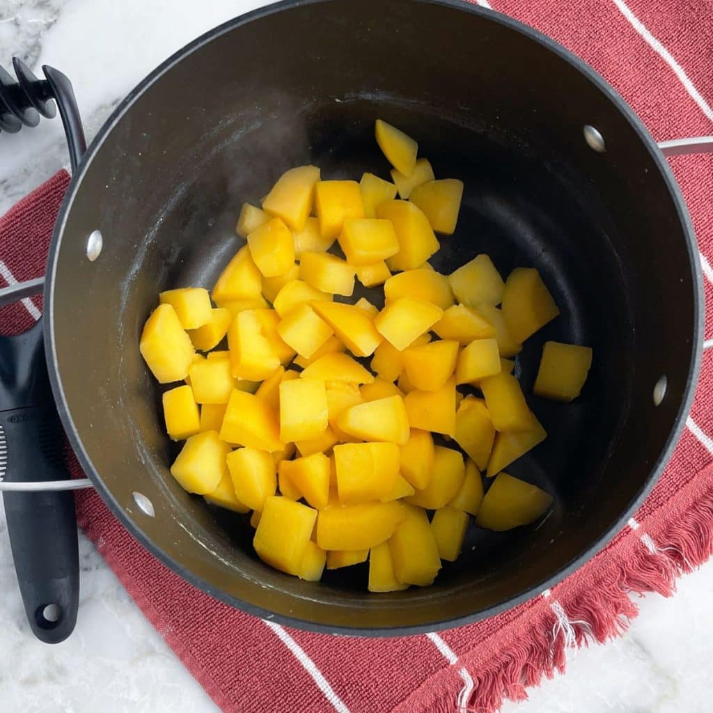 Pot with cooked rutabaga. 