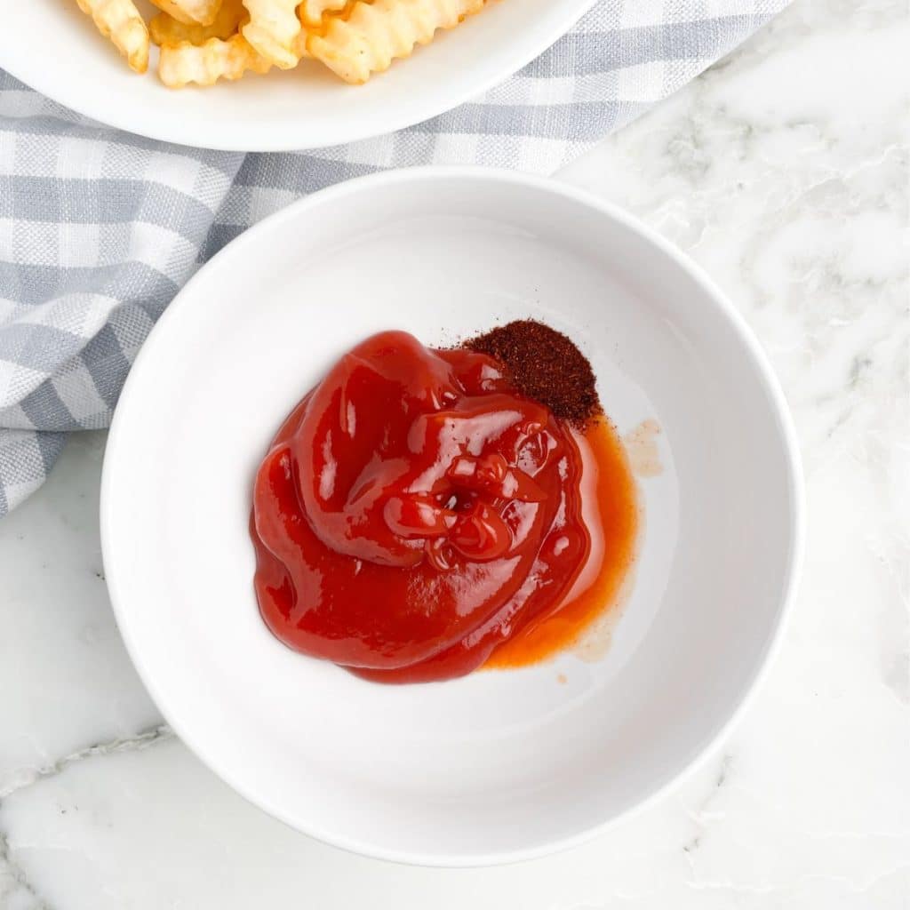 Bowl with ketchup and spices. 