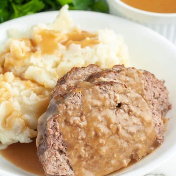 Meatloaf with gravy and mashed potatoes.