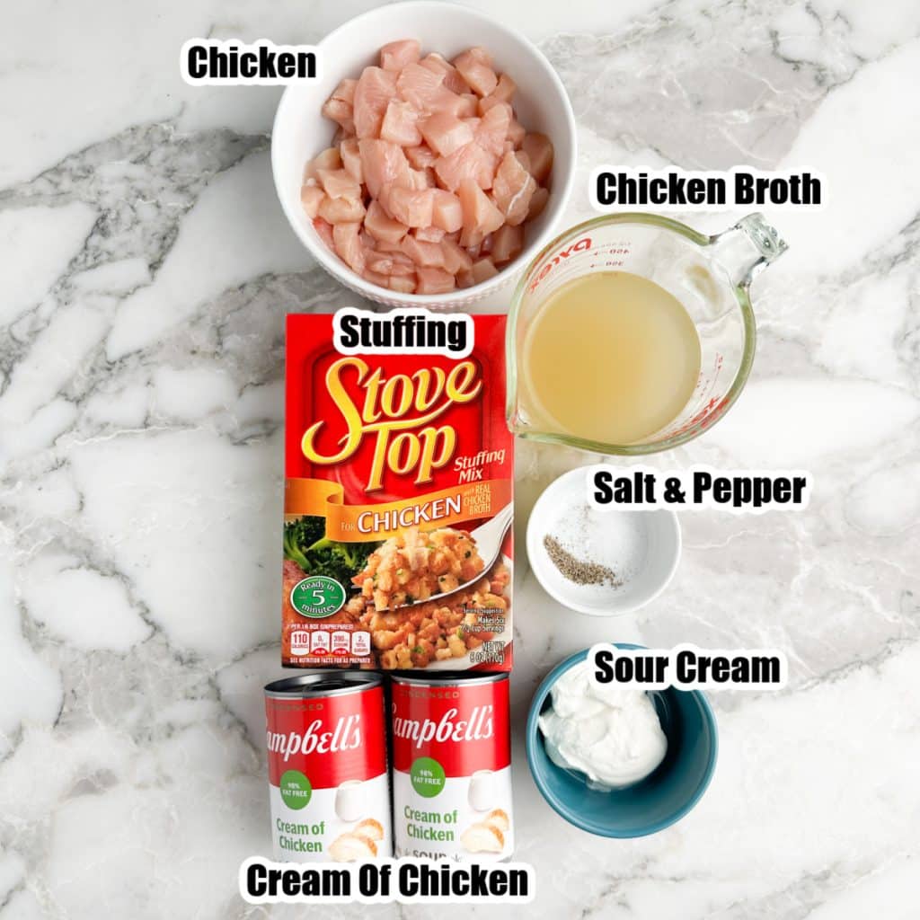 Bowl of diced chicken, stuffing, broth, cans of cream of chicken and sour cream. 