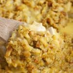 Wooden spoon in chicken stuffing.