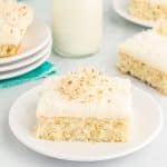Slice of coconut cake on a plate.