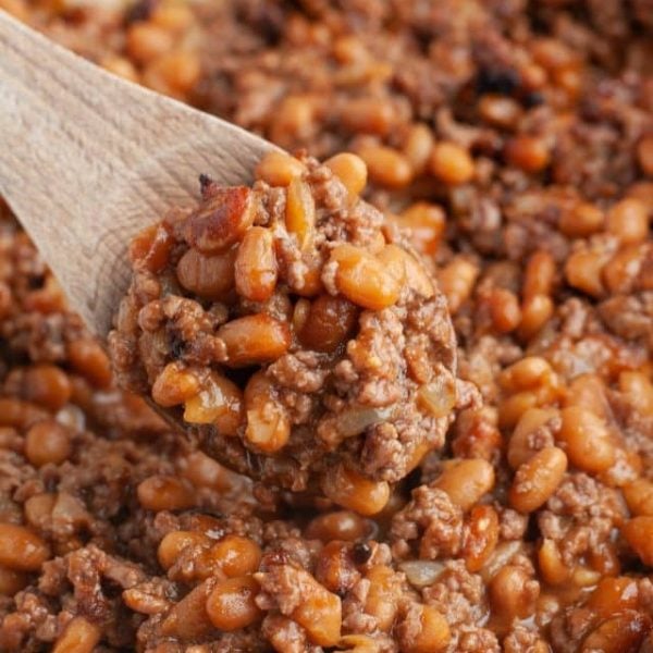 Wooden spoon with baked beans.