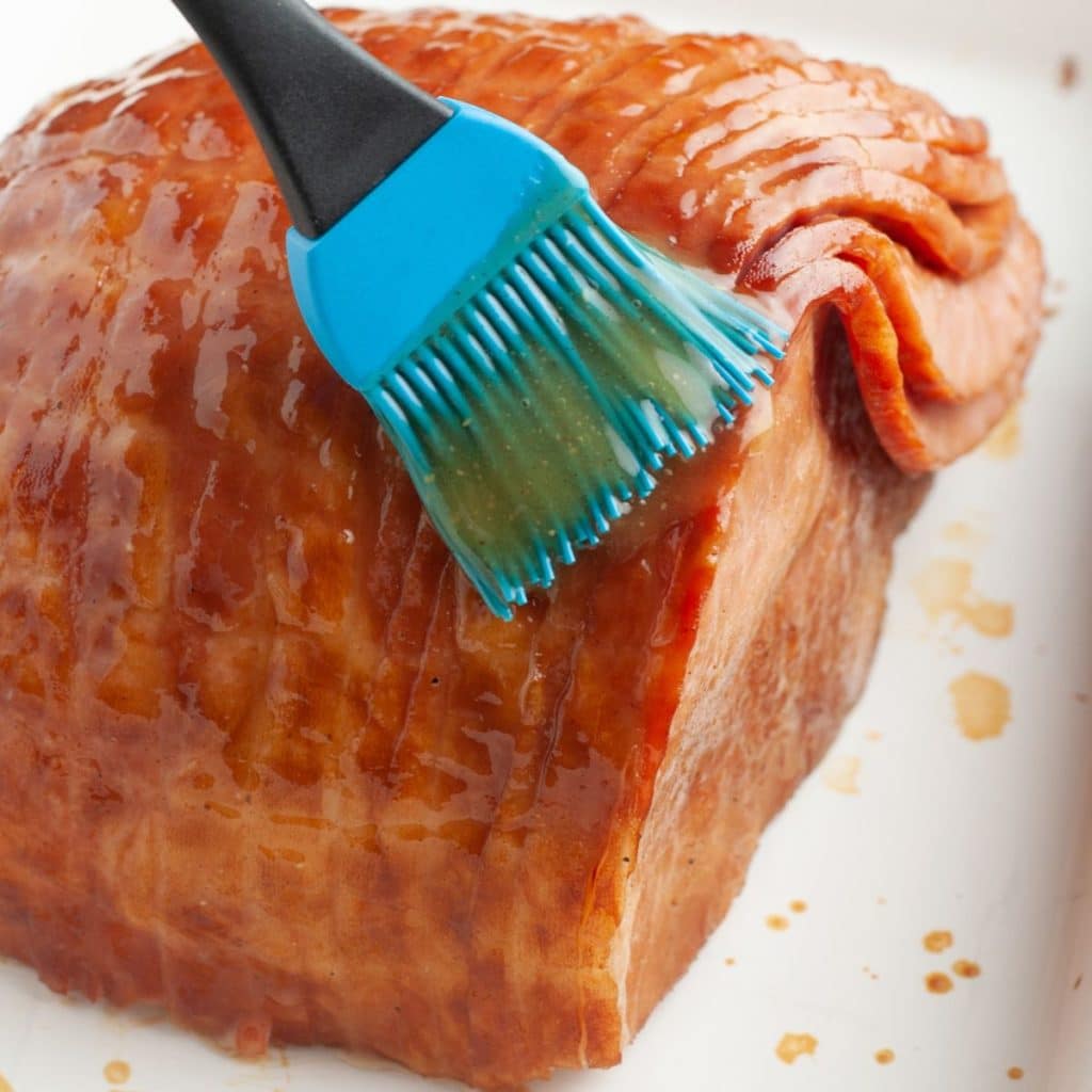 Glaze going on baked ham.
