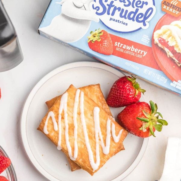 Cooked strudel with frosting and a box of frozen strudel.