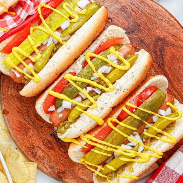 Chicago style hot dogs on a plate.